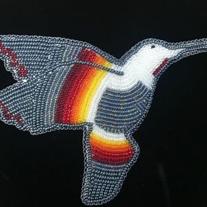 This is a beautiful Beaded Humming Bird hair clip